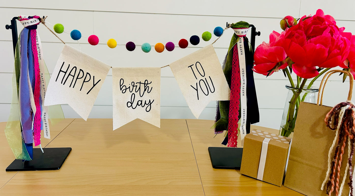 decorative birthday banner with felt balls, ribbon and banner perfect for a client birthday gift