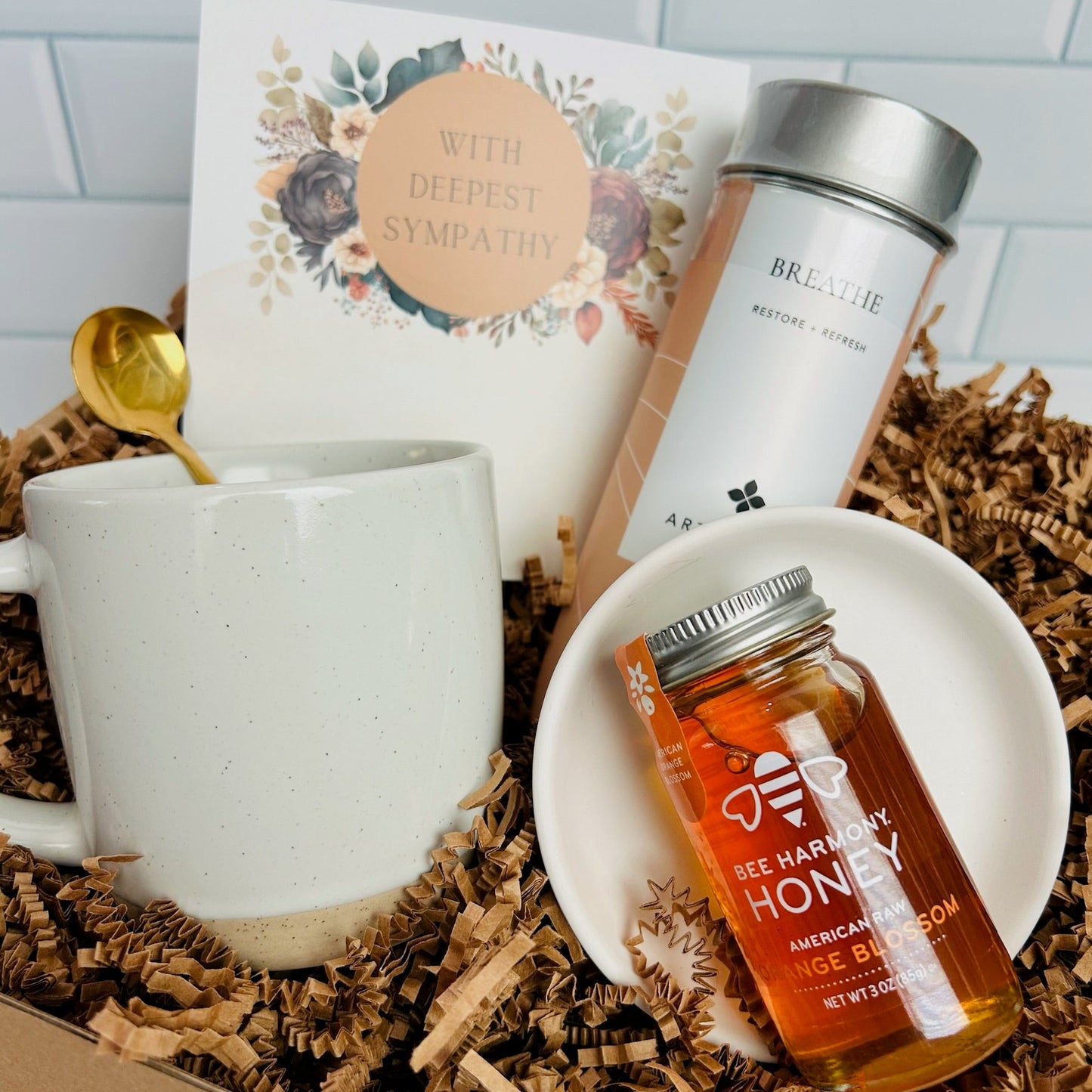 Gift set with mug, honey jar, and sympathy card beautifully packaged.