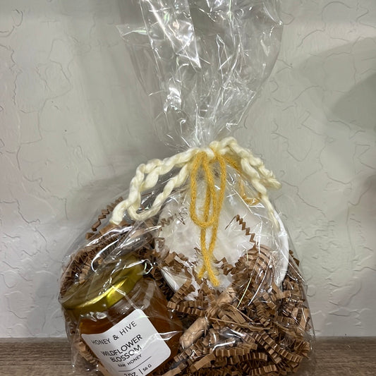 cute realtor check in gift for clients that includes honey a stir stick and small dish