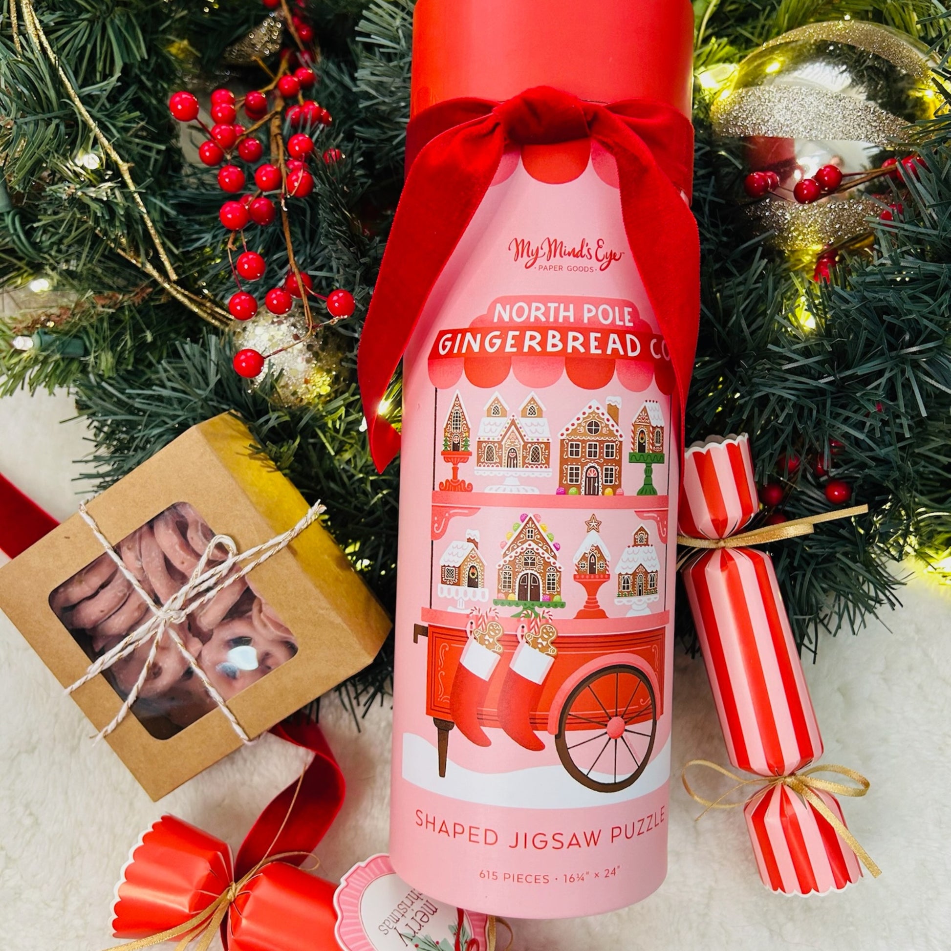 Gift box with north pole gingerbread puzzle, strawberry pretzels and Christmas crackers