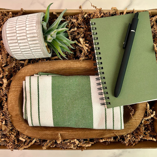 Succulent closing gift for real estate clients with potted plant, kitchen towel, notebook, pen, and new home card – perfect realtor housewarming gift set.