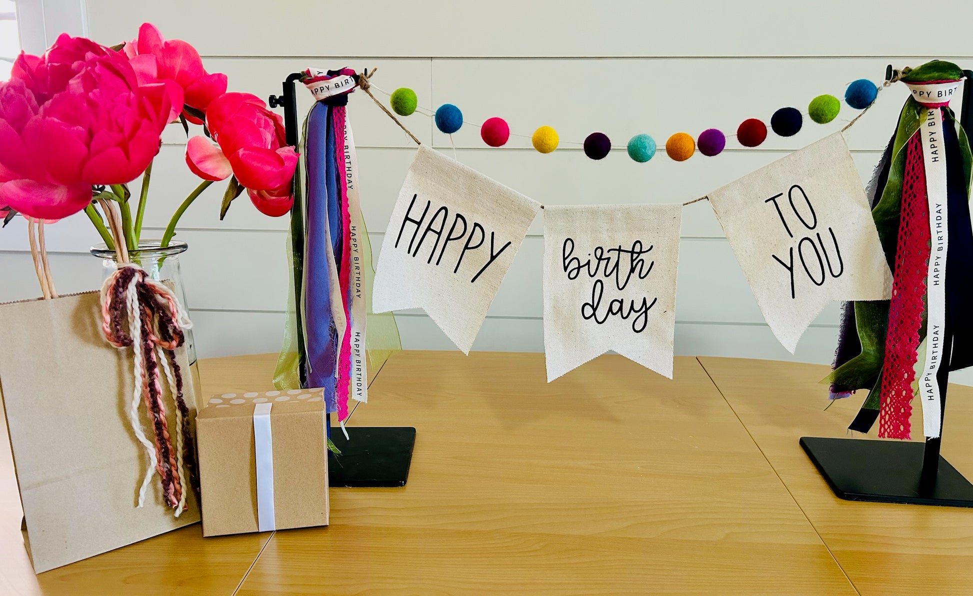 decorative birthday banner with felt balls, ribbon and banner perfect for a client birthday gift