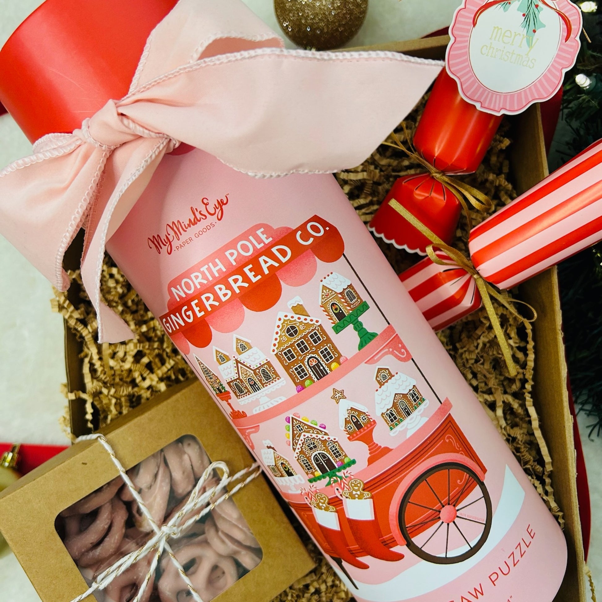 Gift box with north pole gingerbread puzzle, strawberry pretzels and Christmas crackers